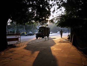 Rear view of people on street in city