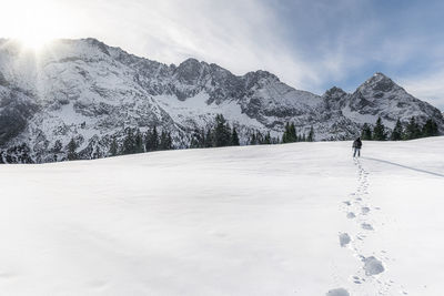 Scenic view of snow covered mountains against sky