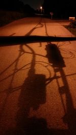 High angle view of shadow on sand at sunset