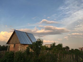 Low angle view of building against sky during sunset