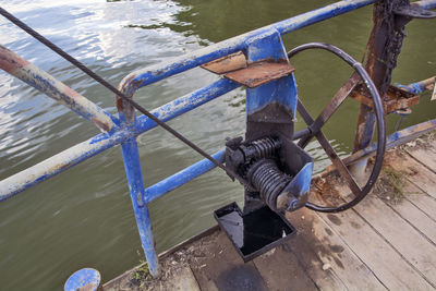 High angle view of rope tied to railing