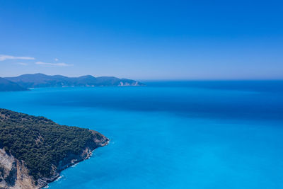 Scenic view of sea against blue sky