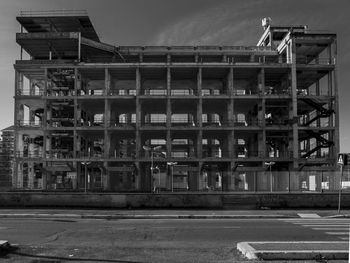 Construction site in city against sky