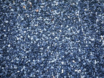 Full frame background of blue decorative gravel stones