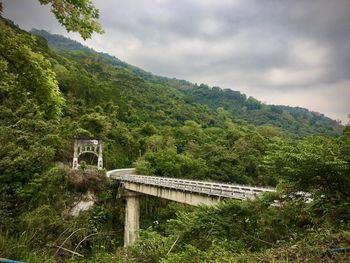 View of bridge on mountain against sky