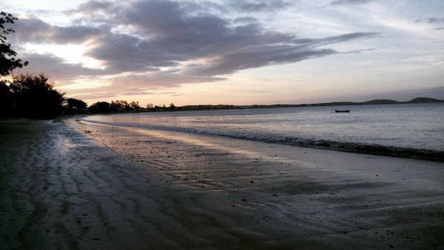 water, beach, sky, sunset, sea, tranquil scene, scenics, tranquility, cloud - sky, beauty in nature, shore, sand, nature, cloudy, cloud, idyllic, dusk, coastline, horizon over water, reflection