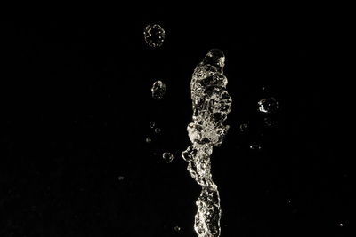 Close-up of water over black background