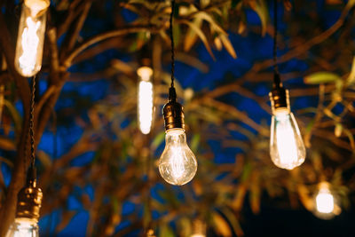 Low angle view of illuminated light bulb