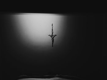 Low angle view of silhouette people on ceiling