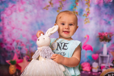 Portrait of cute girl with stuffed toy