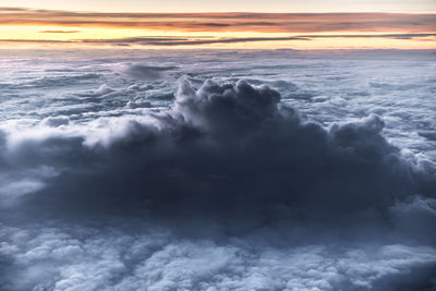 Aerial view of sea against sky during sunset
