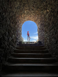 Women looking at view on stairs in medieval village stock picture