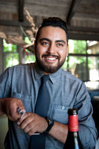 Smiling bartender at bar