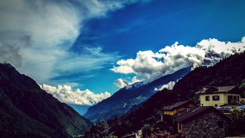 Scenic view of mountains against cloudy sky