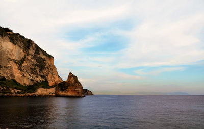 Scenic view of sea against cloudy sky