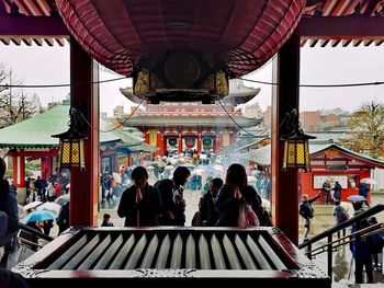 Group of people in temple outside building