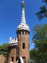 Low angle view of tower against clear blue sky