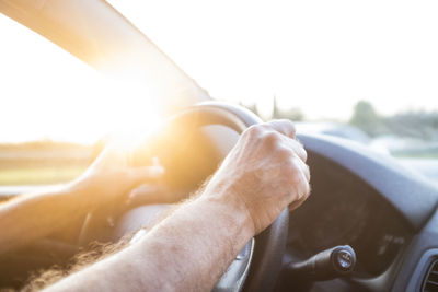 Close-up of man driving car