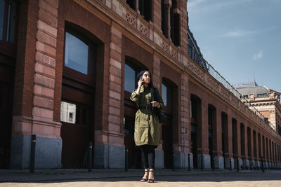 Rear view of woman walking on street