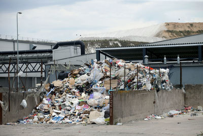 Garbage on metal structure against sky