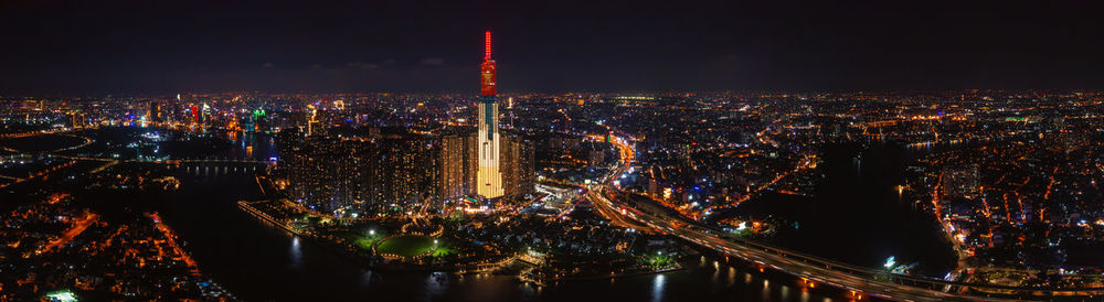 Illuminated city buildings at night