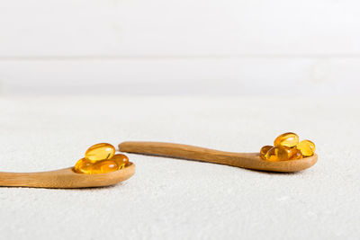 Close-up of wooden spoon on white background