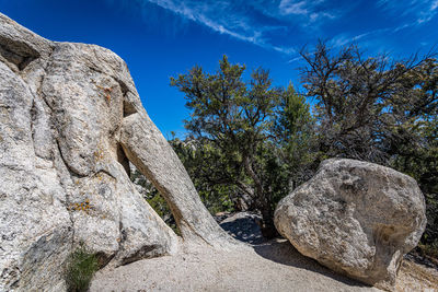 Low angle view of rock formation against sky