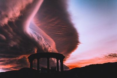 Low angle view of cloudy sky at sunset