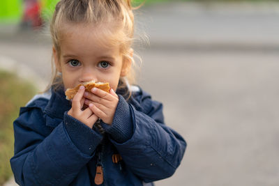 Portrait of girl eating food