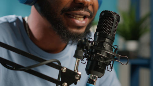 Close-up of man holding microphone