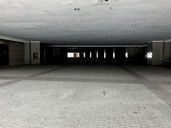 Empty parking lot against building