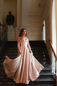 Young woman on staircase