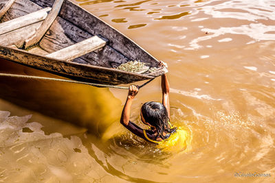 High angle view of man swimming in water