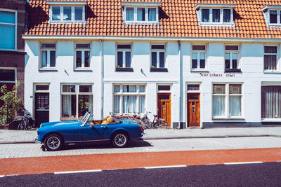 Car on street against building