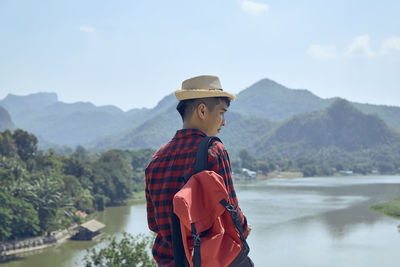 Rear view of man looking at mountains