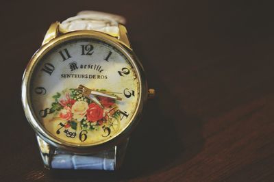 Close-up of wristwatch on table