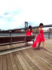 Woman standing on pier