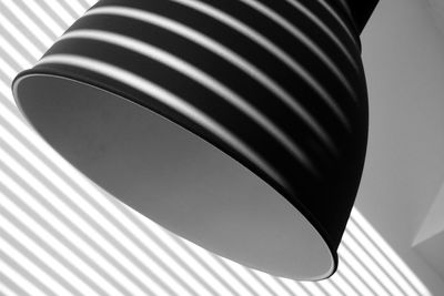 Low angle view of electric lamp on ceiling