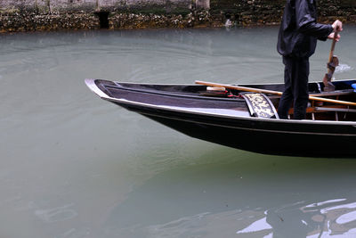 Secret canal in venice, italy, the silence of the gondola and gesture of the gondolier