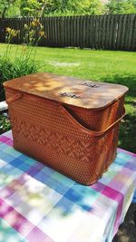 Wicker basket by swimming pool in yard