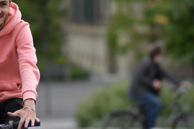 Midsection of couple walking in city