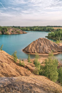 Picturesque landscape of sandy rocks and lake with blue or turquoise clear water. konduki, tula. 