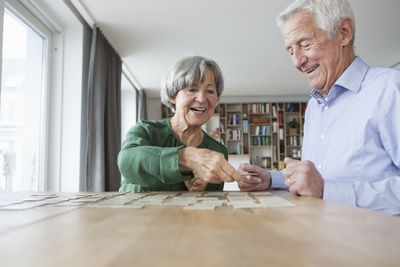 Senior couple playing memory at home