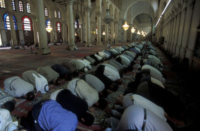Men offering prayers at mosque