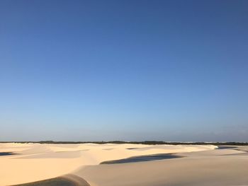 View of desert against blue sky