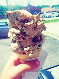 Cropped hand holding ice cream cone