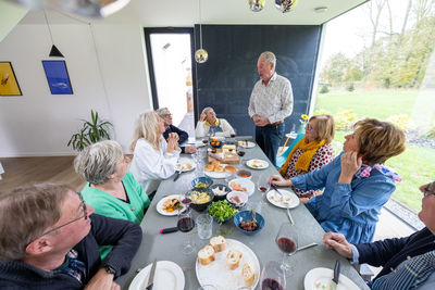 High angle view of family having food at home