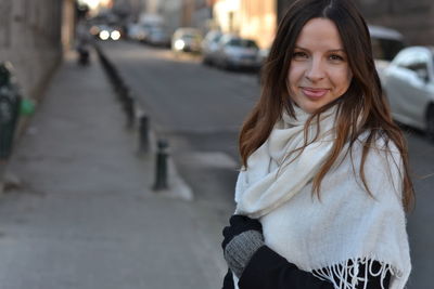 Portrait of smiling young woman outdoors