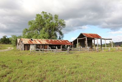 Built structure on field against sky