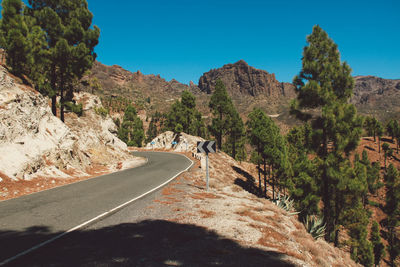 Scenic view of mountains against clear blue sky